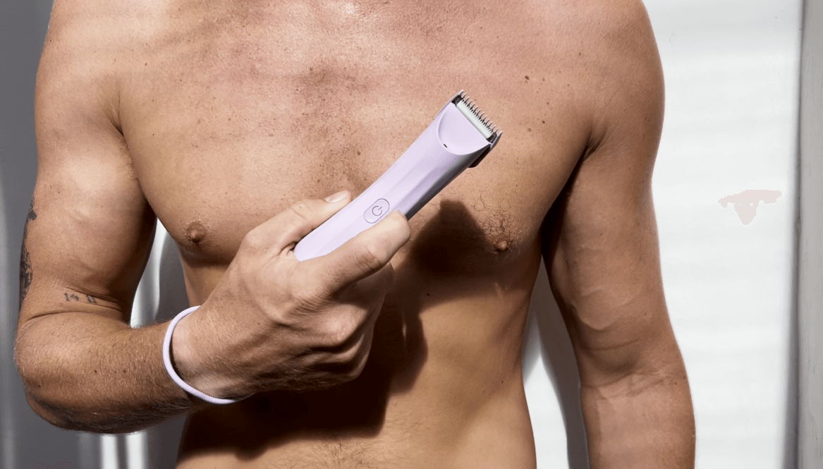 A male model holding the Archibald trimmer against his chest